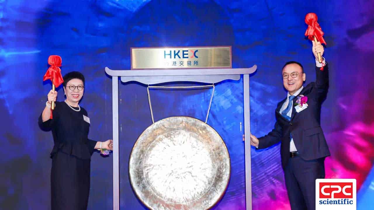 CEO Shawn Lee and Medtide CEO Vickie Xu ring the ceremonial gong at the Hong Kong Stock Exchange (HKEX) during Medtide's 2025 IPO